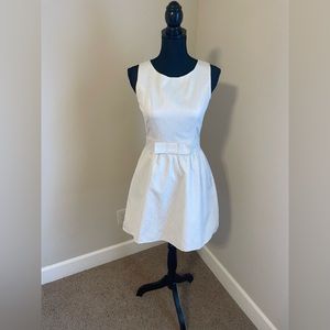 Francesca’s off-white subtle-sparkle dress with front bow. Size S.